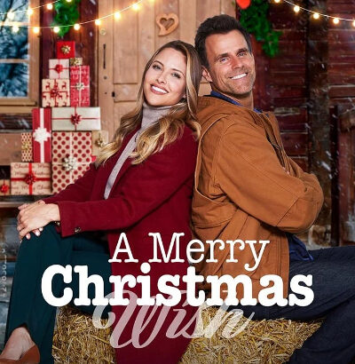 Affiche du film A Merry Christmas Wish avec un couple devant un chalet décoré pour Noël